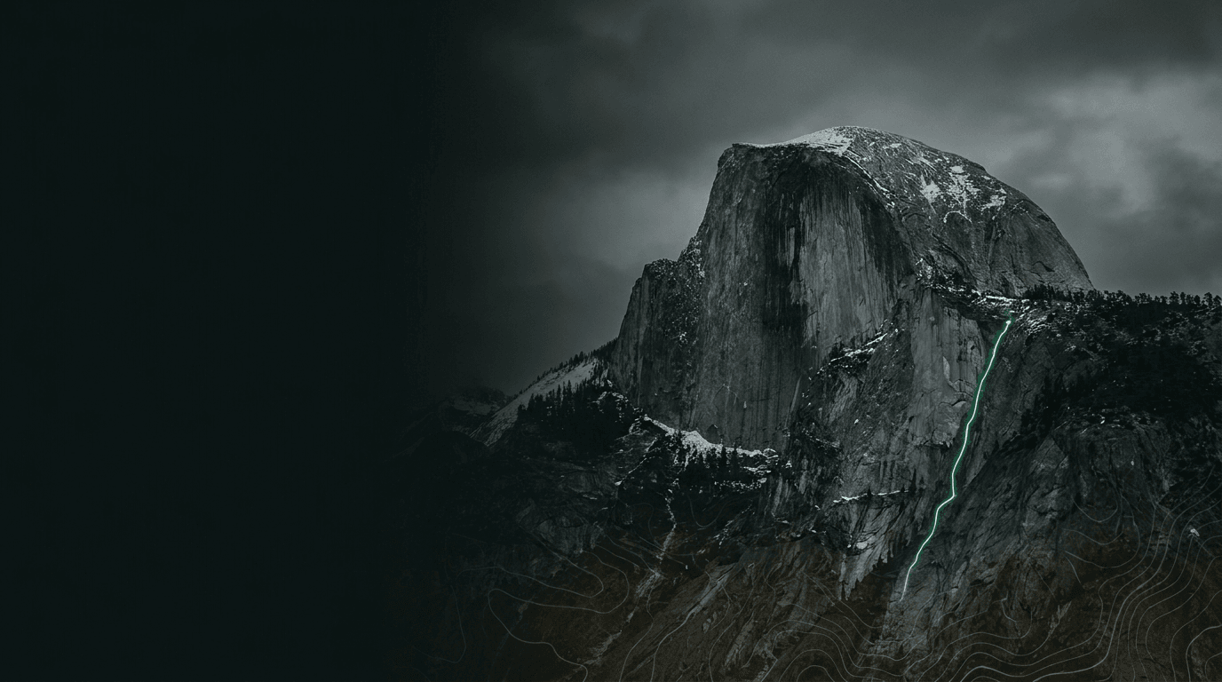 Half Dome under storm cloud, a climbing route traced in green up its granite face